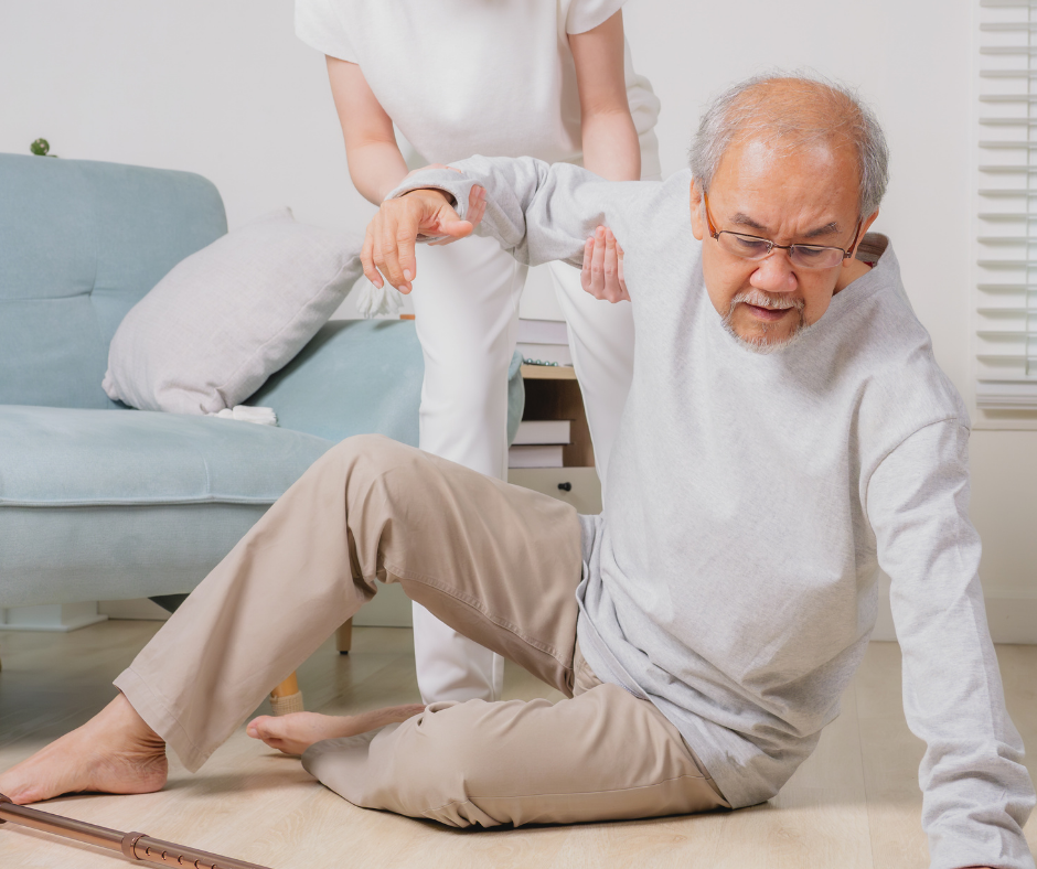 person lifting senior man off ground